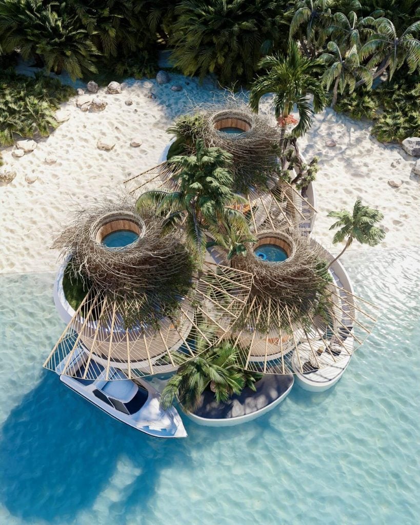 Vista cenital de una vivienda de lujo a pie de playa en Maldivas 