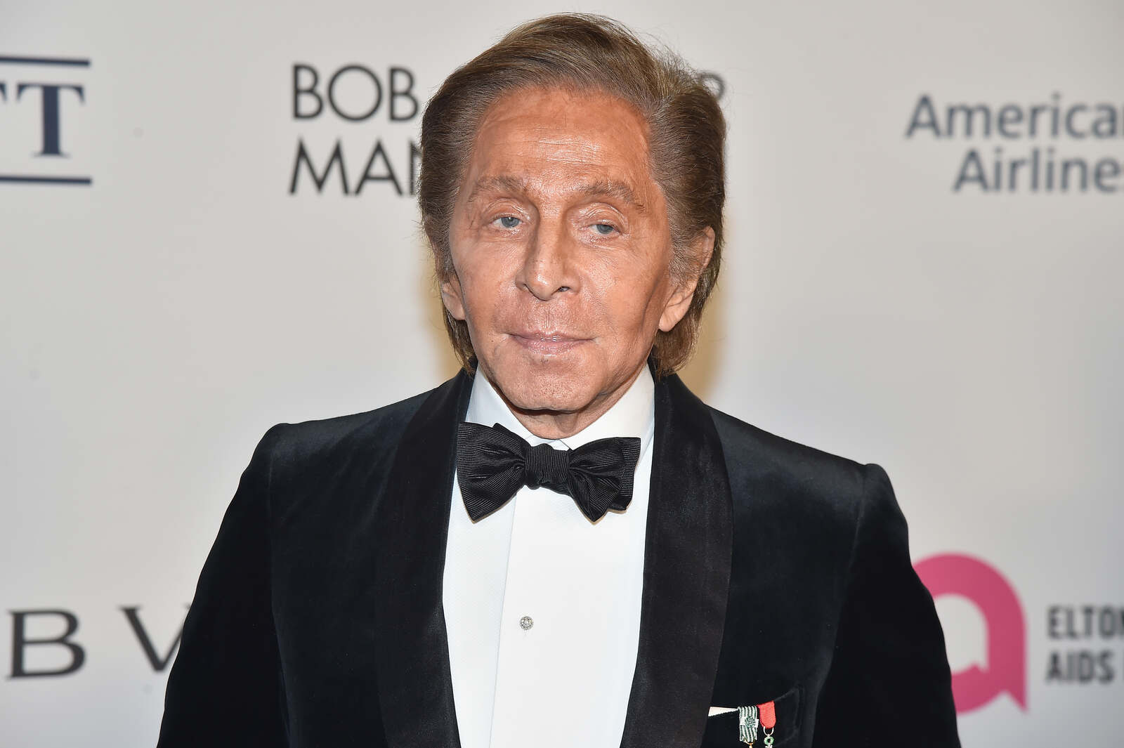 Valentino posando en un photocall