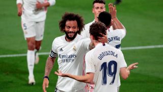 Marcelo celebra un gol con Odriozola. (EFE)