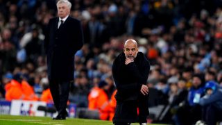 Pep Guardiola, con Ancelotti de fondo. (EP)