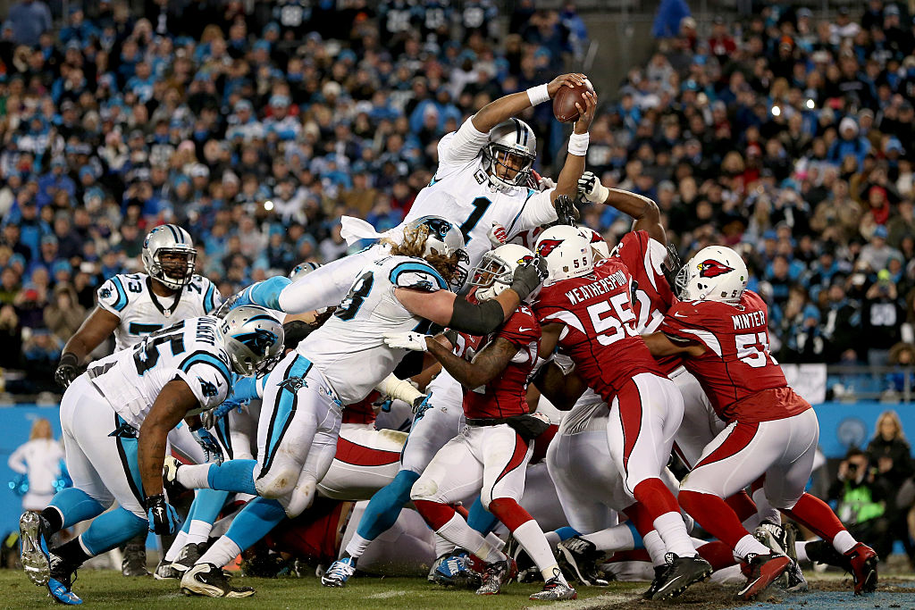 CHARLOTTE, NC - JANUARY 24:  Cam Newton #1 of the Carolina Panthers scores a touchdown in the second quarter against the Arizona Cardinals during the NFC Championship Game at Bank of America Stadium on January 24, 2016 in Charlotte, North Carolina.  (Photo by Streeter Lecka/Getty Images)