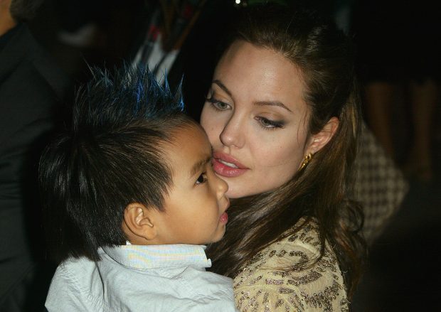 VENICE, ITALY - SEPTEMBER 10: Actress Angelina Jolie and her son Maddox attend the World Premiere of "Shark Tale" in San Marco Square, as part of the 61st Venice Film Festival on September 10, 2004 in Venice, Italy. (Photo by Pascal Le Segretain/Getty Images)