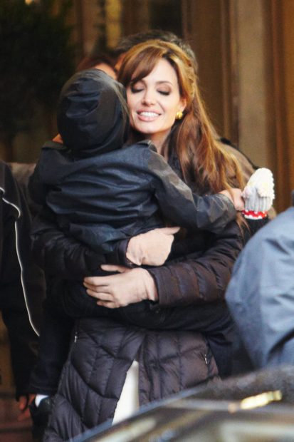PARIS - FEBRUARY 25: Actress Angelina Jolie and her son Maddox as she films in Place des Victoires of Paris for the Movie "The Tourist" on February 25, 2010 in Paris, France. (Photo by Lorenzo Santini/Getty Images)