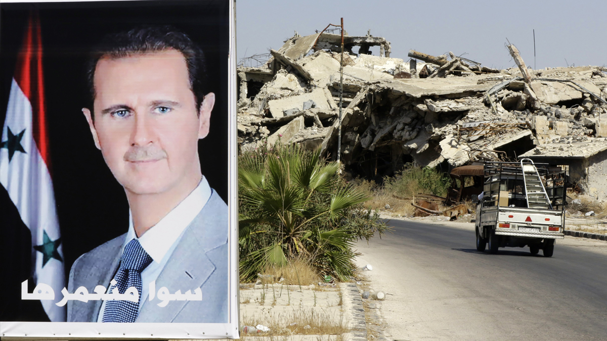 Un cartel de Bashar Al Assad en Homs. (Foto: AFP)