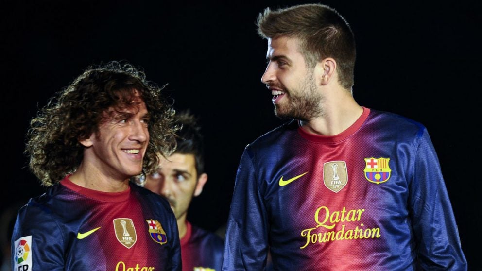 Puyol y Piqué durante un partido con el Barcelona. (Getty)