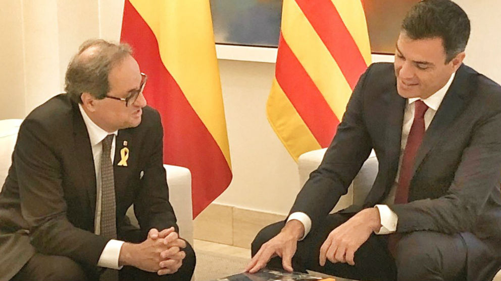 El presidente del Gobierno, Pedro Sánchez, junto al jefe de la Generalitat, Quim Torra.