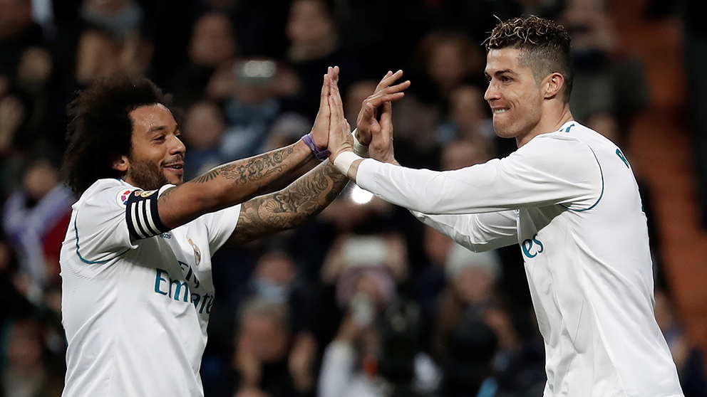 Cristiano Ronaldo y Marcelo celebran un gol con el Real Madrid. (Getty)