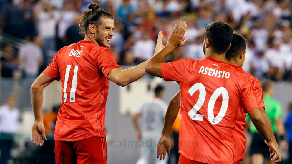 Gareth Bale y Marco Asensio celebran uno de los goles del Real Madrid – Roma. (realmadrid.com)