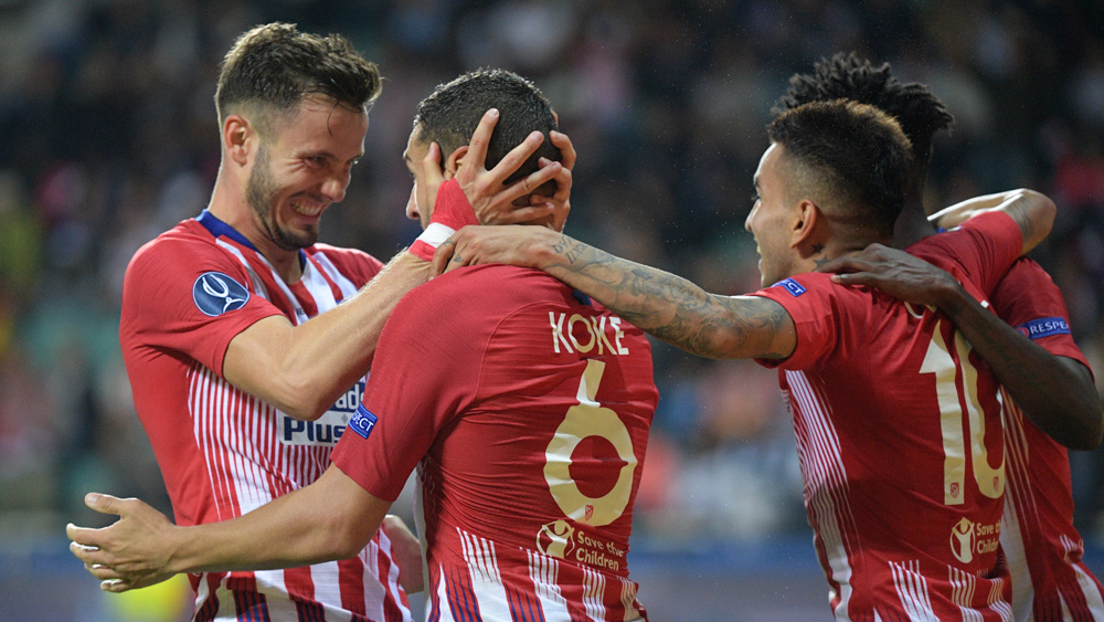 Saúl y Koke celebran el gol de este último (AFP).