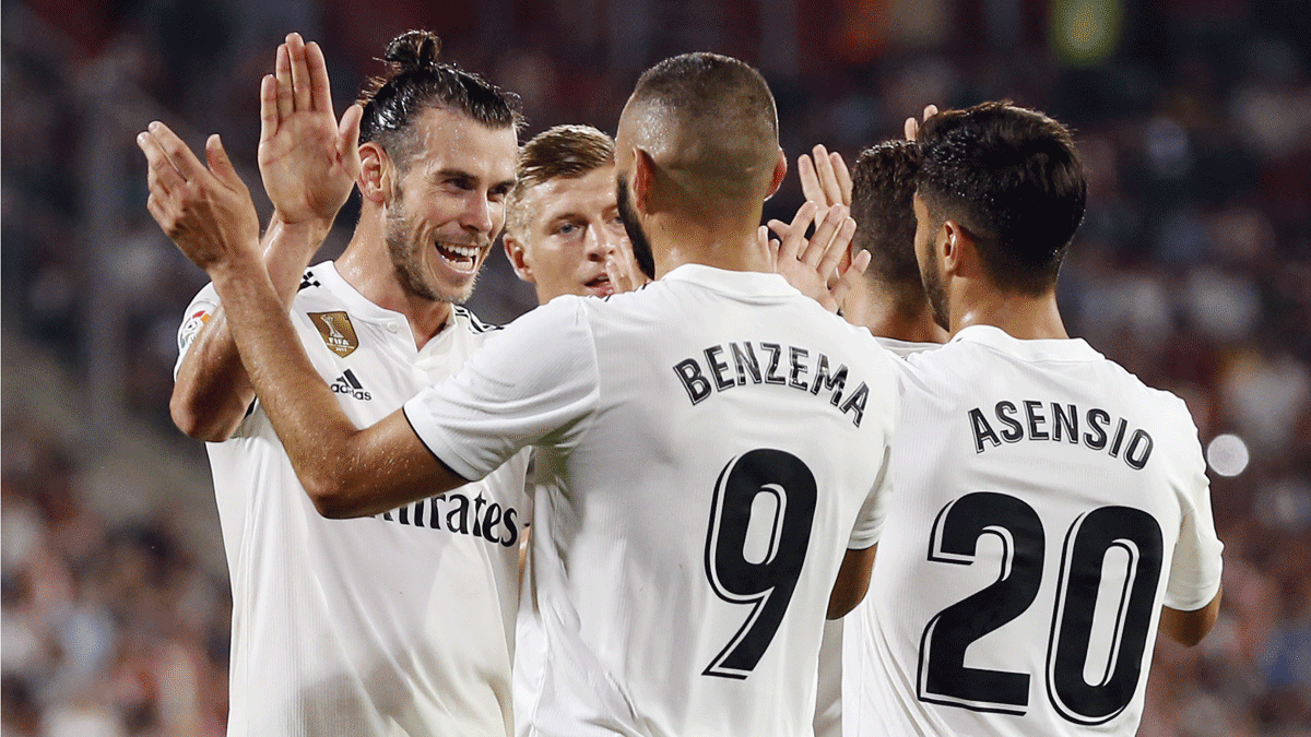 Benzema, Bale y Asensio celebran un gol.