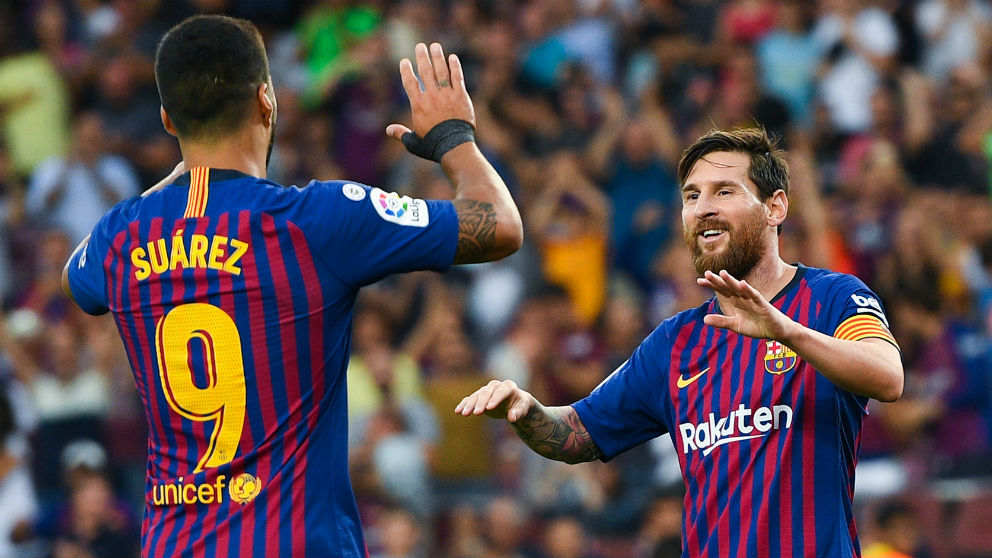 Luis Suárez y Messi celebran un gol del Barcelona. (Getty)