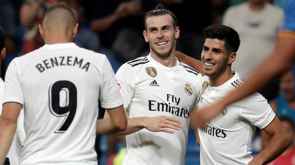 Benzema, Bale y Asensio celebran un gol la pasada temporada. (Getty)
