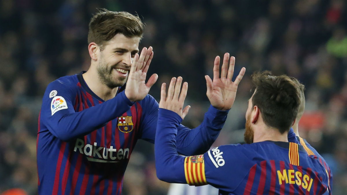 Leo Messi y Gerard Piqué durante un partido. (AFP)