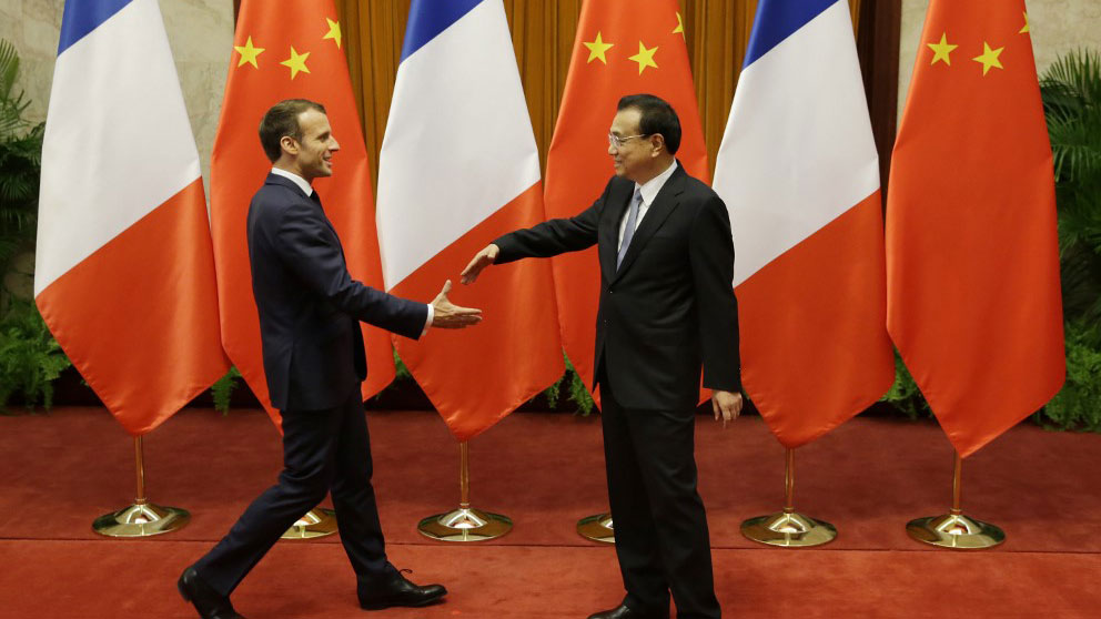 Emmanuel Macron y Xi Jinping. Foto: AFP