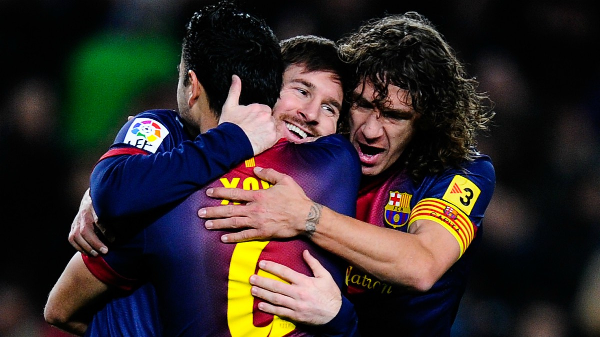 Xavi, Puyol y Messi celebran un gol del Barcelona. (Getty)