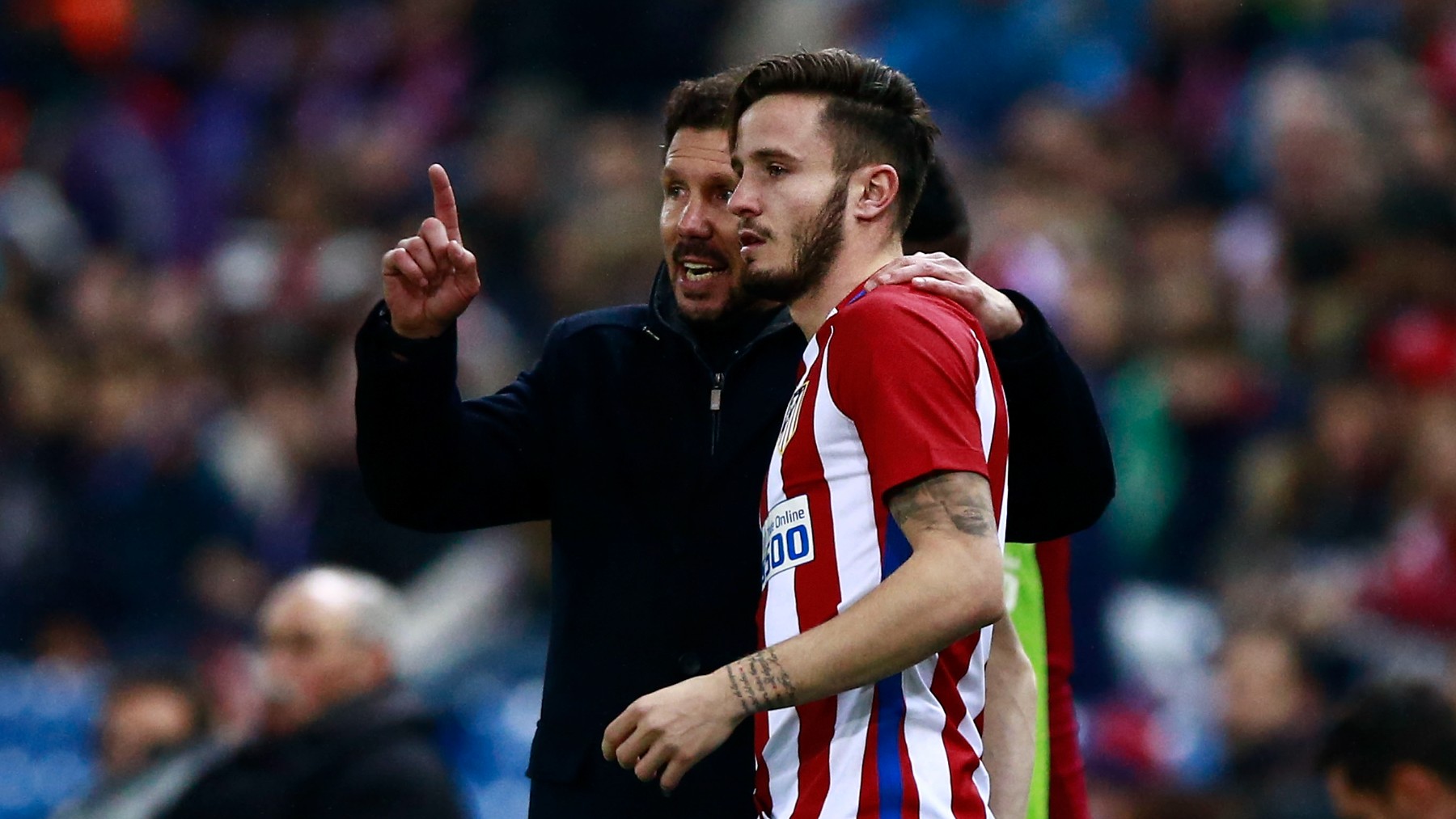 Simeone y Saúl, durante un partido. (Getty)