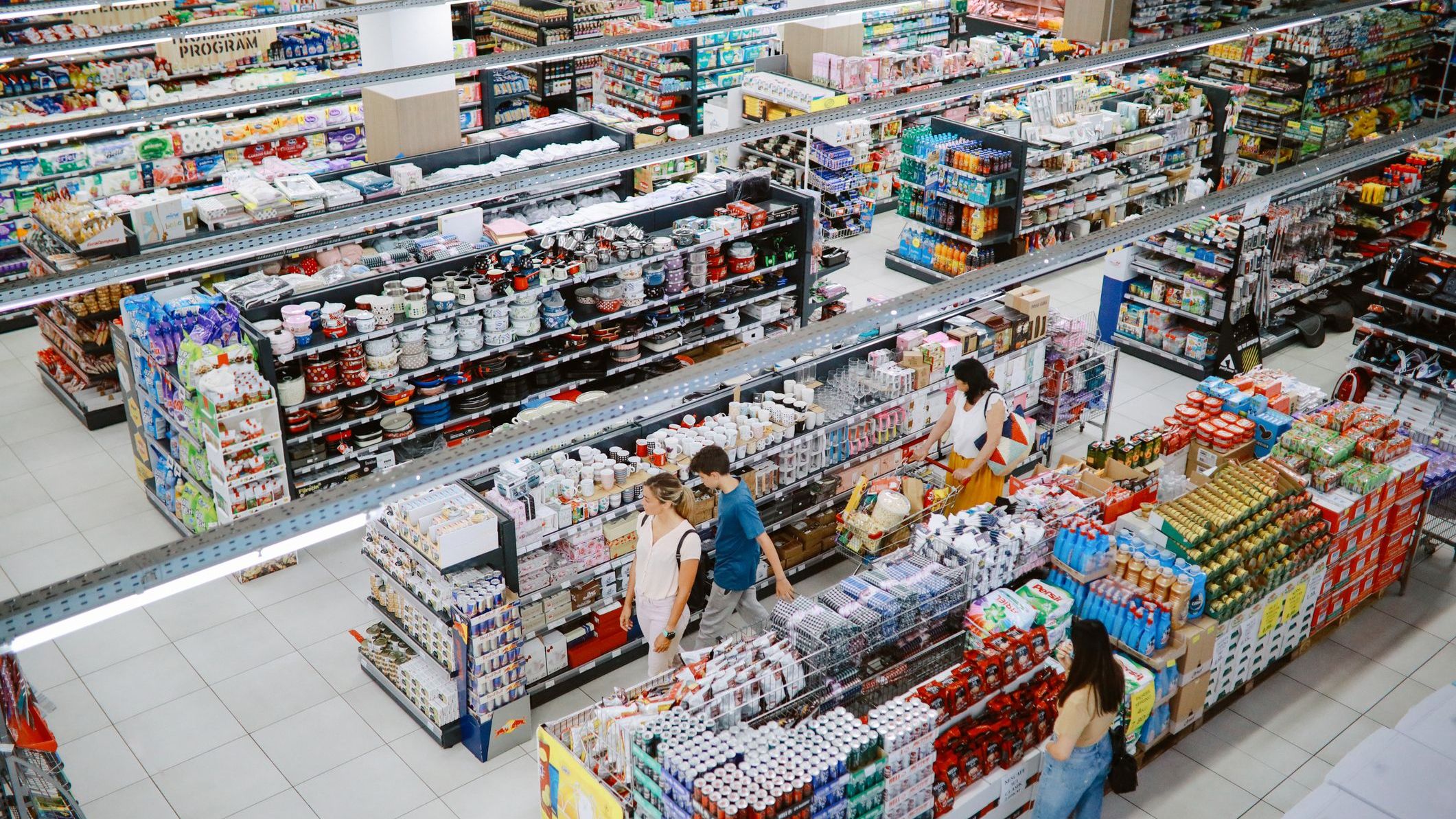 Overhead image of people buying in the large supermarket