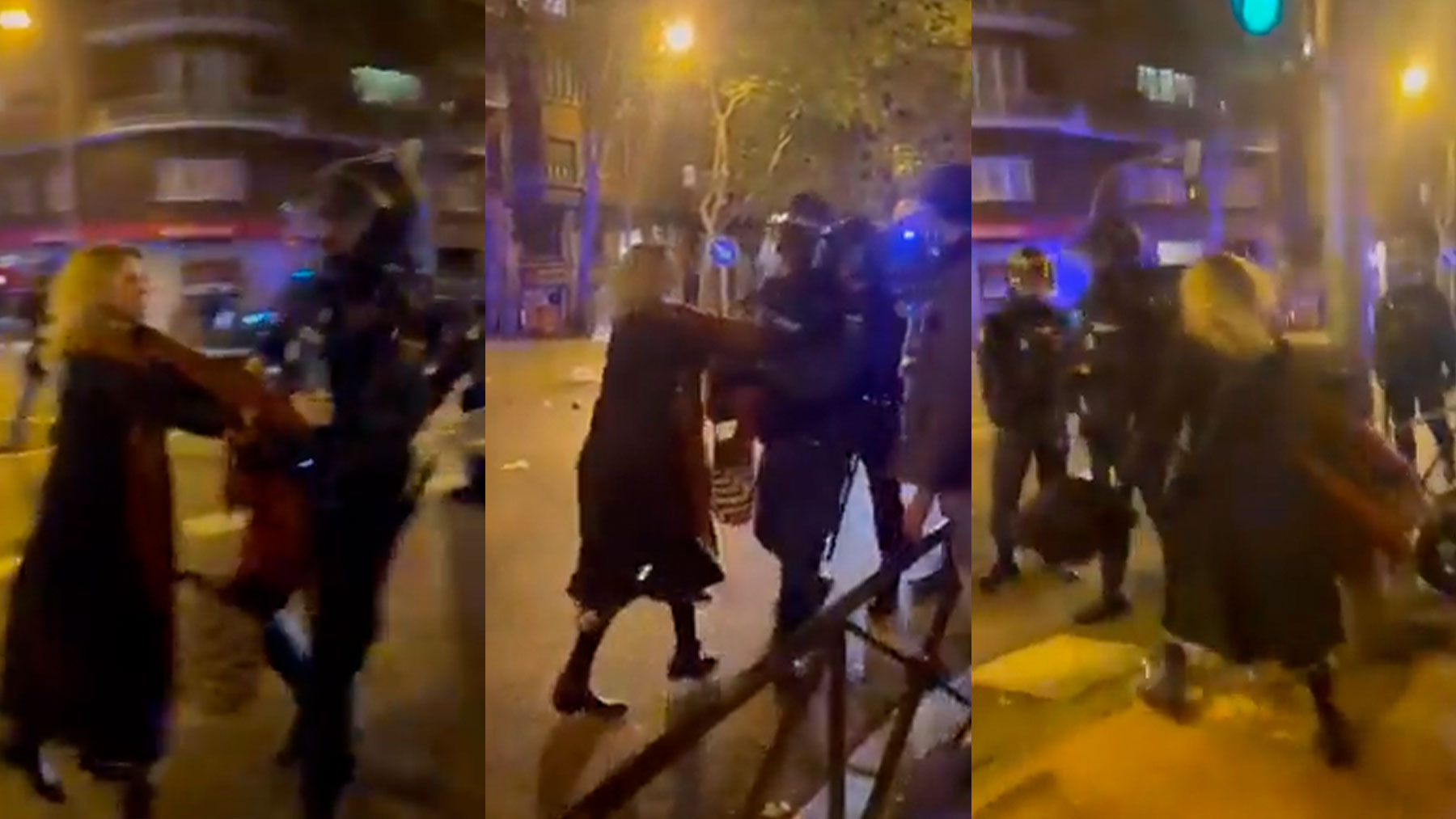 Mujer empujada por la Policía Nacional