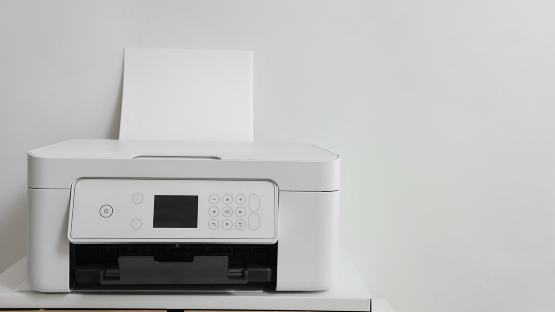 Modern,Printer,With,Paper,On,Table,Near,White,Wall,,Space