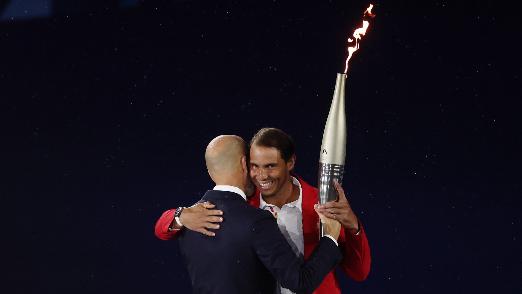 Rafa Nadal y Zinedine Zidane con la llama olímpica. (Getty)