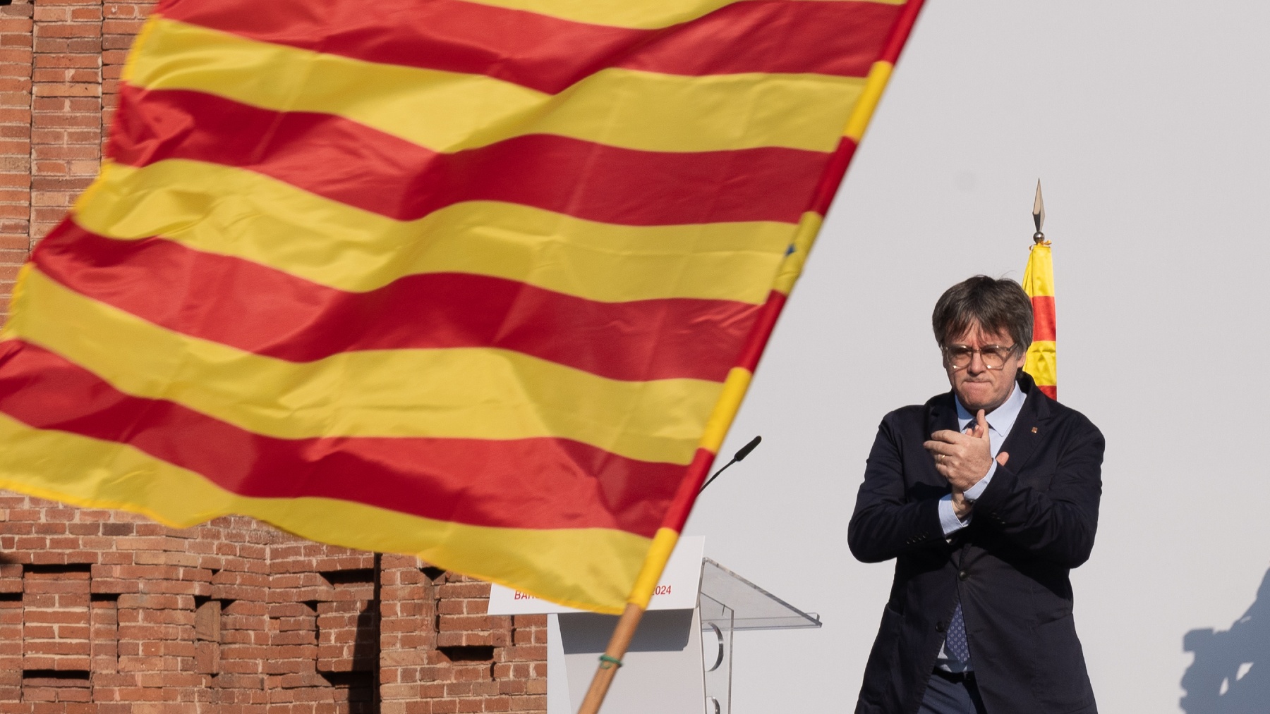 Puigdemont durante el acto de bienvenida organizado por entidades independentistas en Barcelona. (Foto: EP)