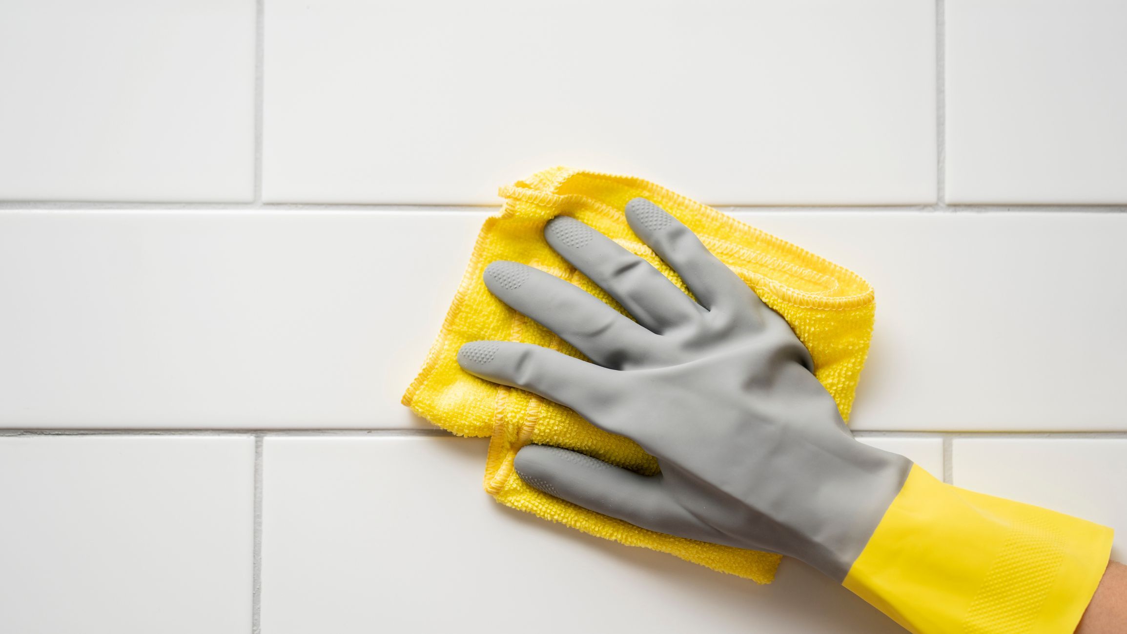 Houseworker wipes the surface with a napkin