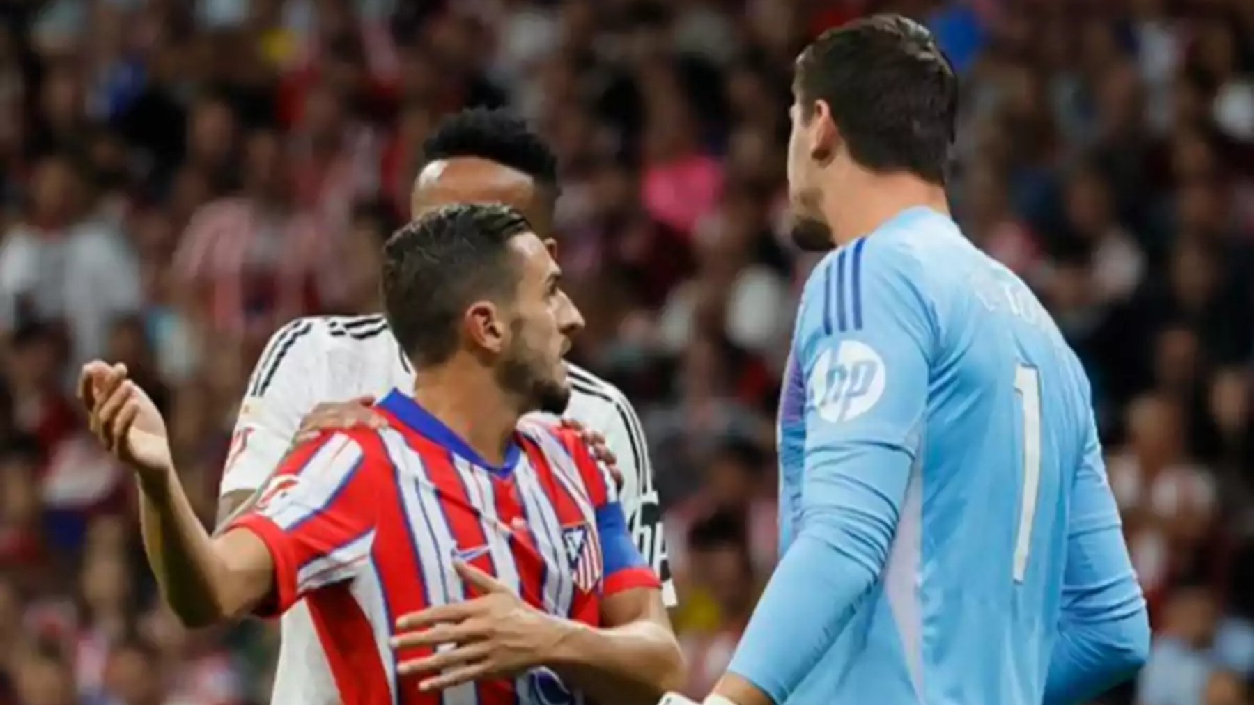 Koke y Courtois, en el pasado derbi.