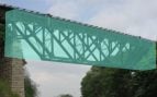 Puente de Lockport que pasa sobre el canal Erie cerca de Buffalo, Nueva York. Los investigadores del MIT imitaron esta estructura, resaltada en azul verdoso, y crearon múltiples diseños exclusivos. Foto: MIT