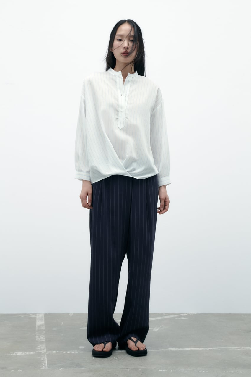 5 camisas blancas de nuestras tiendas favoritas por menos de 15 euros: son un b&aacute;sico en tu armario