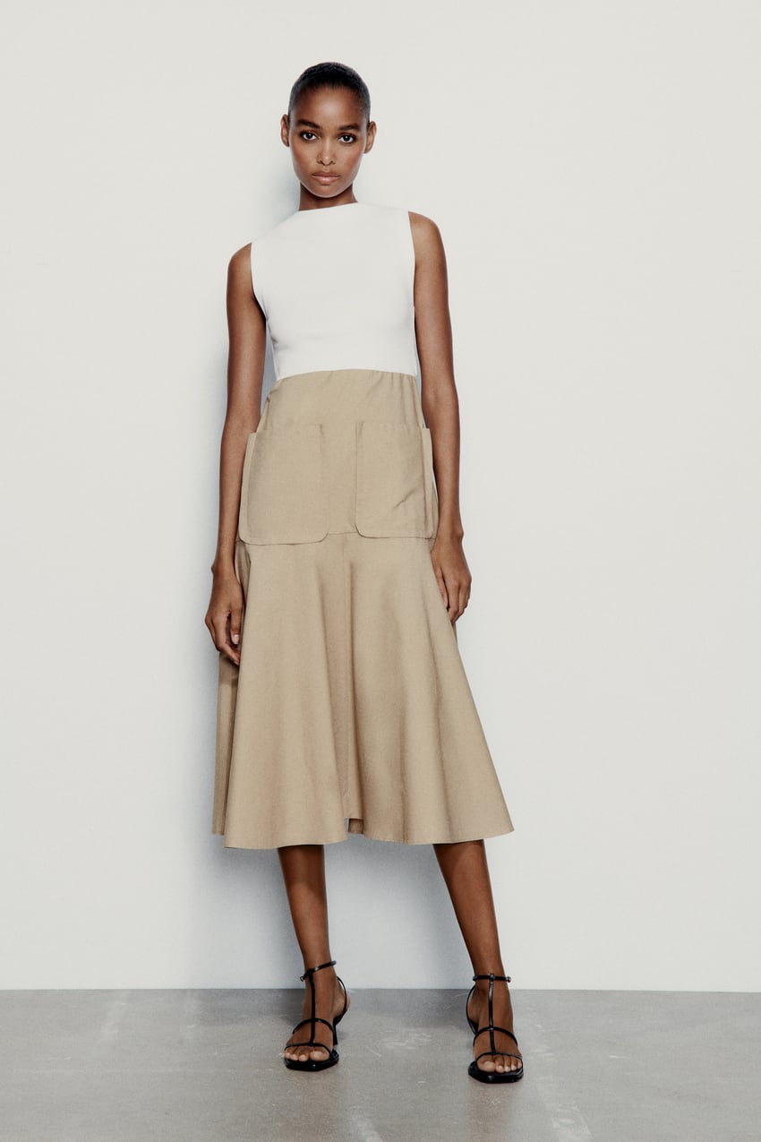 Este vestido midi de cuello redondo de Zara es ideal para disimular barriga