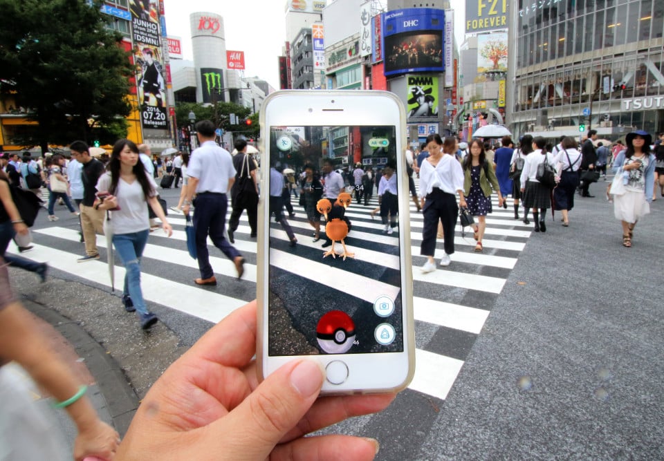 A fan tries out Pokemon Go in Tokyo's Shinjuku district on July 22, 2016, Tokyo, Japan. The Pokemon Go app finally arrived in the land of the Pokemon on Friday 22, July two weeks after its launch in the United States. The release of the app in Japan had been rumoured for the past few days after the leak of details of a partnership deal with McDonald's Japan to create Pokemon Gyms in its 3,000 locations. Nintendo's market value has almost doubled since the app created by Niantic first launched in America. Pictured: Pokemon Go players in Japan on arrival of app in Japan Ref: SPL1322474 220716 Picture by: Aflo / Splash News Splash News and Pictures Los Angeles: 310-821-2666 New York: 212-619-2666 London: 870-934-2666 photodesk@splashnews.com