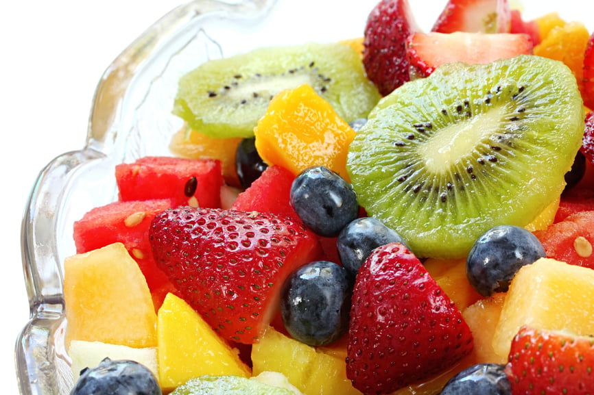 Fresh fruit salad in a crystal bowl.  Luscious healthy eating, with kiwi fruit, strawberries, blueberries, canteloupe, watermelon, mango, oranges, and passionfr