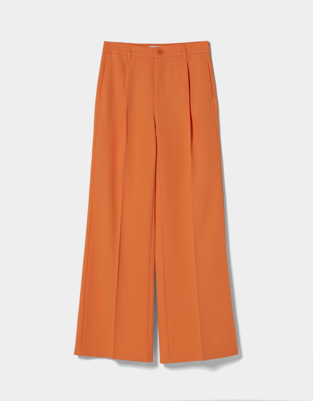 El pantalón naranja de Bershka para combinar con un crop top