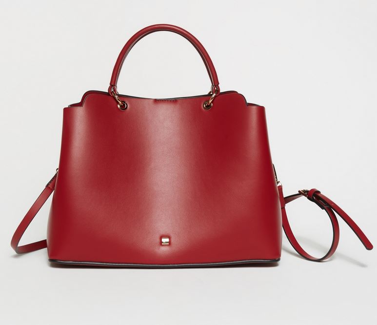 Continue to add color to your fall look with Sfera's red bag