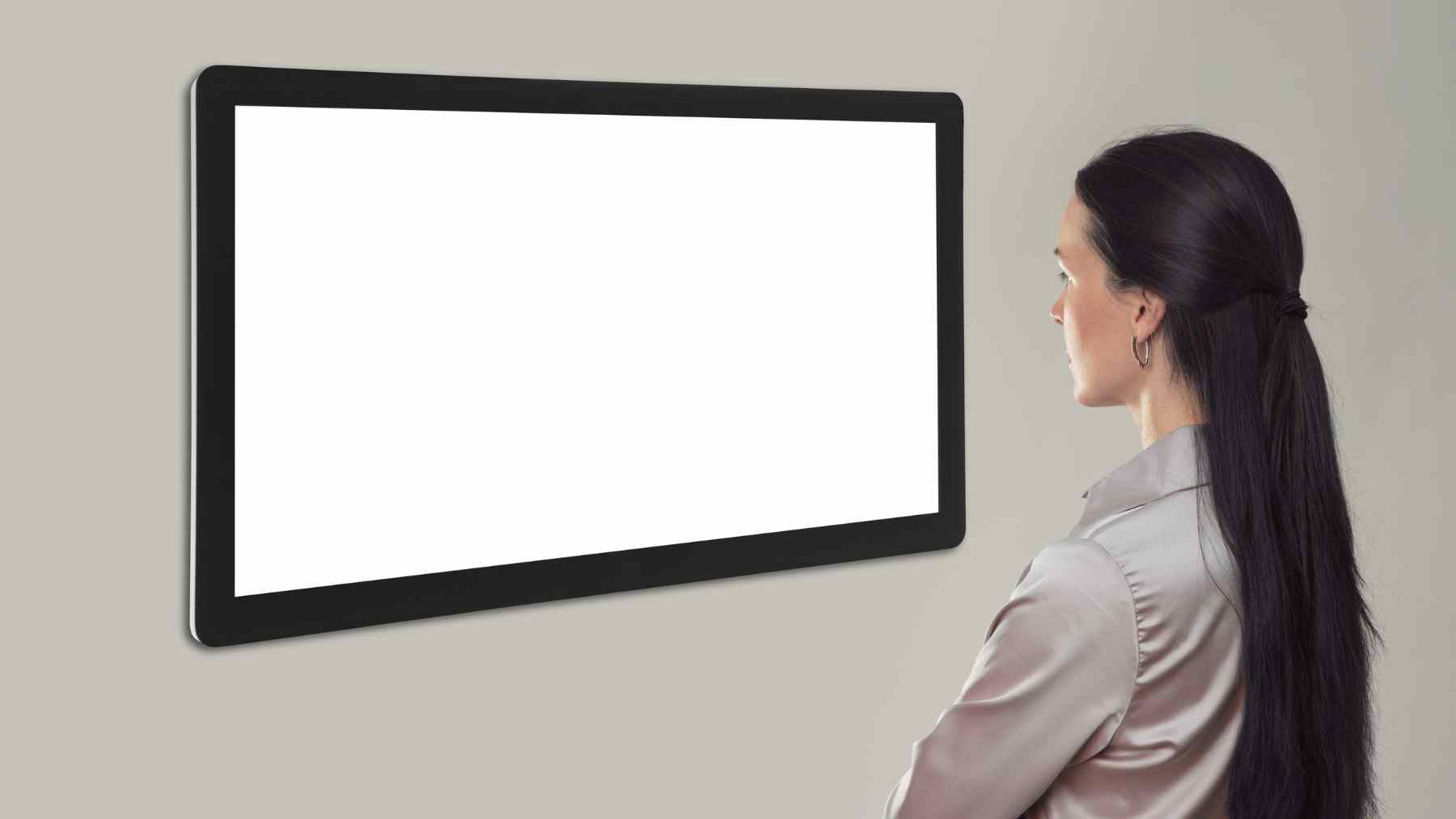 Person struggling to write on a blank page as anxiety and fear of mistakes cause writer’s block