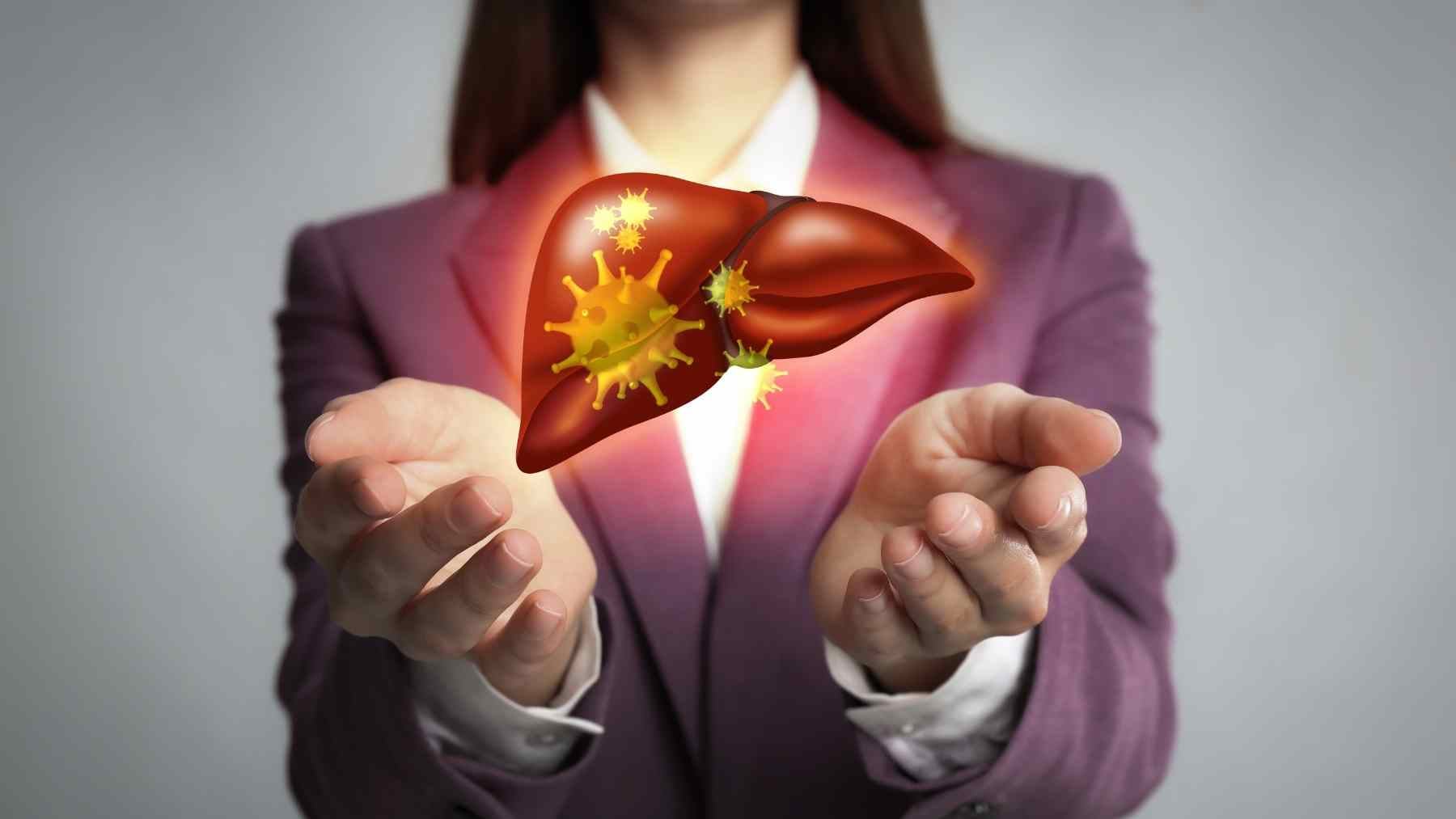 Woman holding a digital liver illustration for a story on fiber supplements, gut health, and fatty liver disease