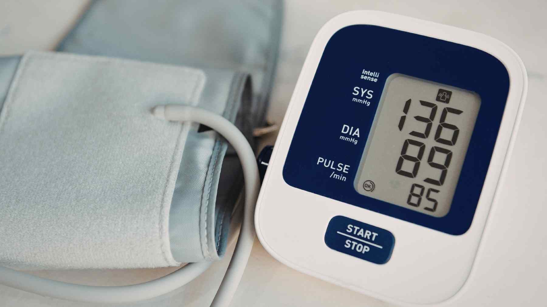 Digital blood pressure monitor showing high blood pressure levels linked to chronic kidney disease and resistant hypertension