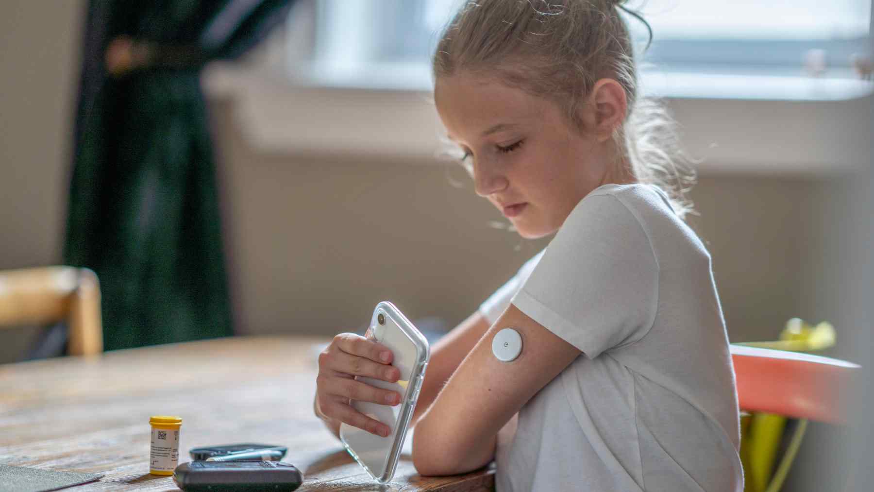 Person sleeping in bed at night, reflecting the daily burden of type 1 diabetes management and insulin dosing.