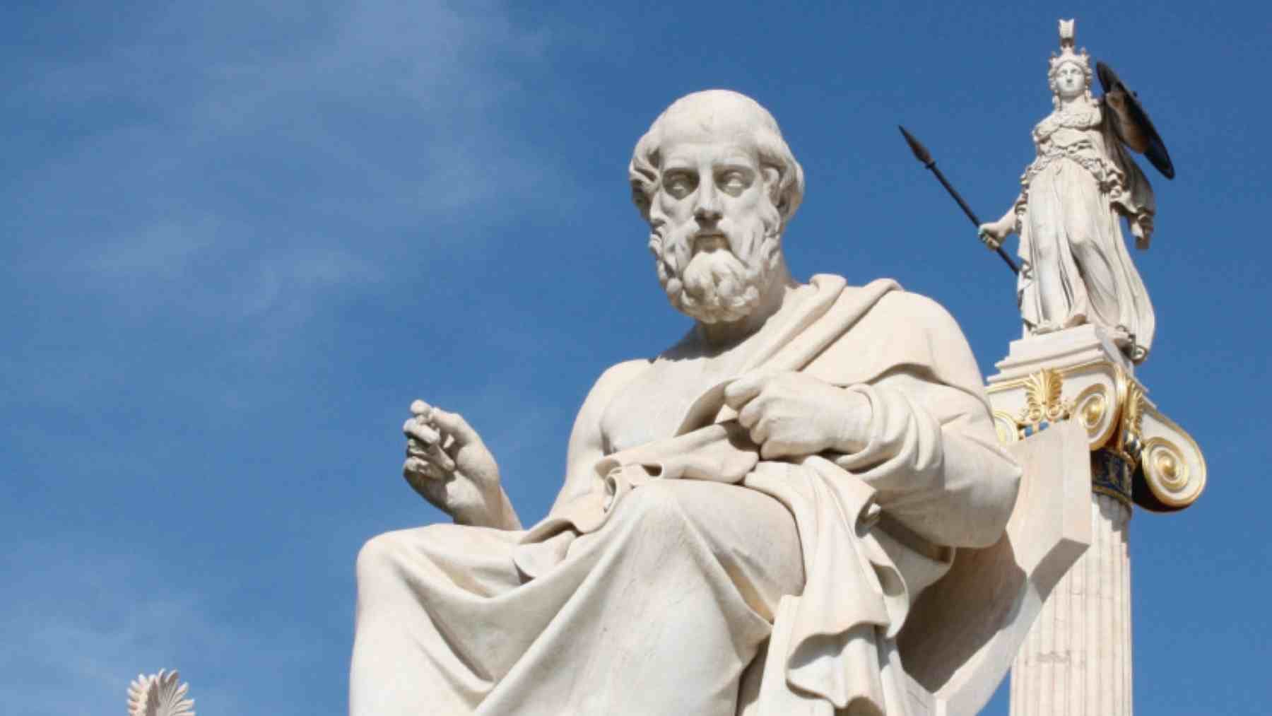 Statue of Plato with Athena behind it, illustrating his quote about poverty, wealth, and growing desires.
