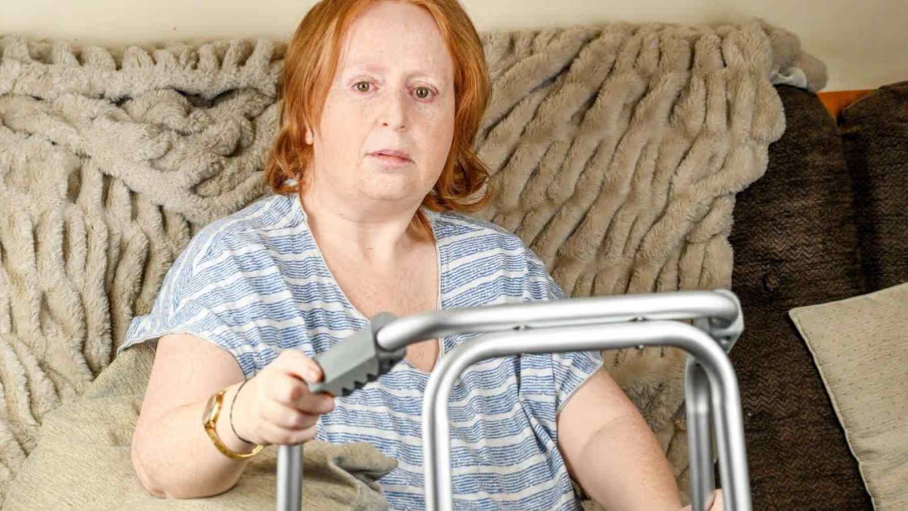 Samantha Smith at home with a walking frame after years of unnecessary chemotherapy treatment