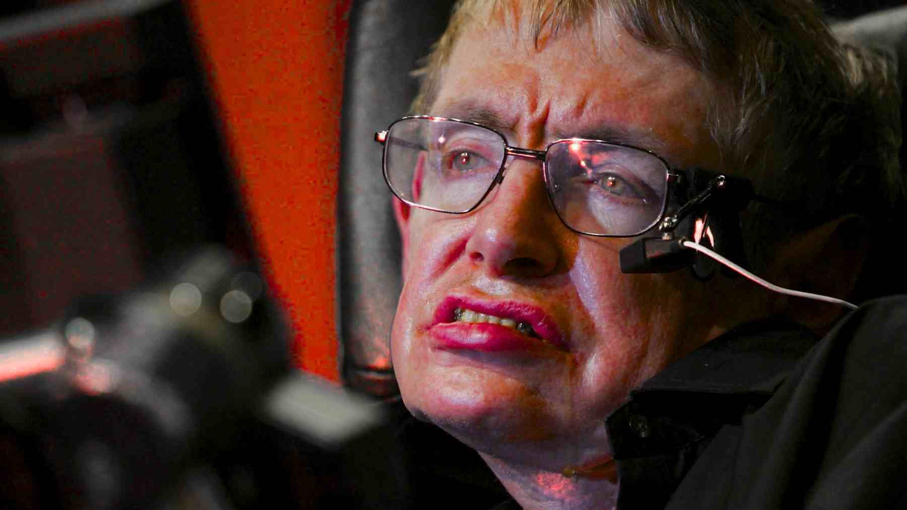 Stephen Hawking using a speech device, known for his work on black holes and his views on quiet intelligence