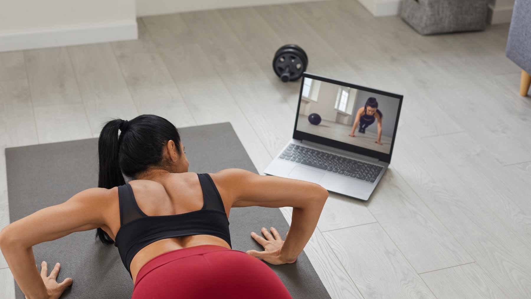 A person performing guided mobility exercises on a yoga mat to improve joint range of motion and reduce muscle stiffness.