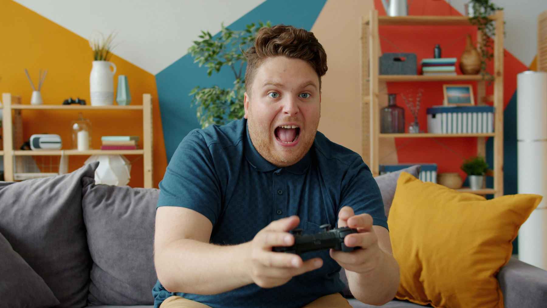 Adult playing a retro video game as psychology research explores nostalgia, memory, and reconnecting with childhood identity.