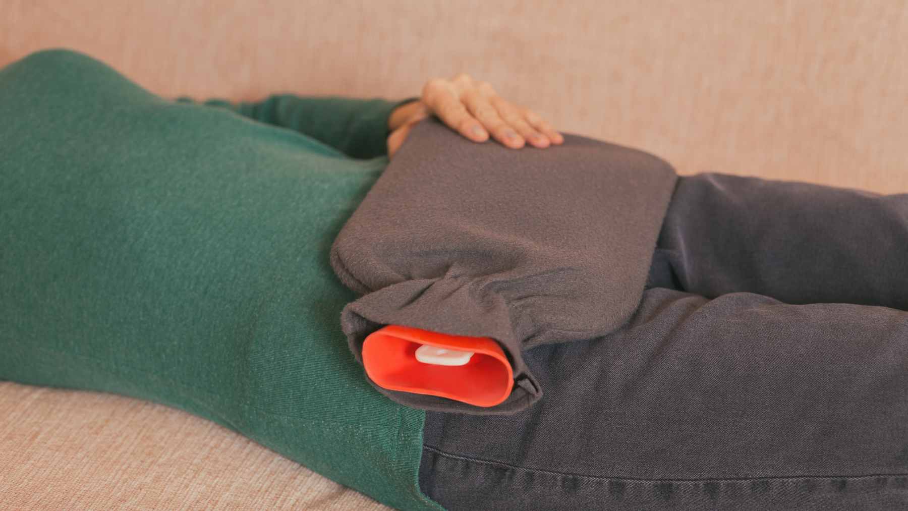 A hot water bottle being prepared with cool water and placed in the refrigerator to serve as a cooling aid for summer sleep.