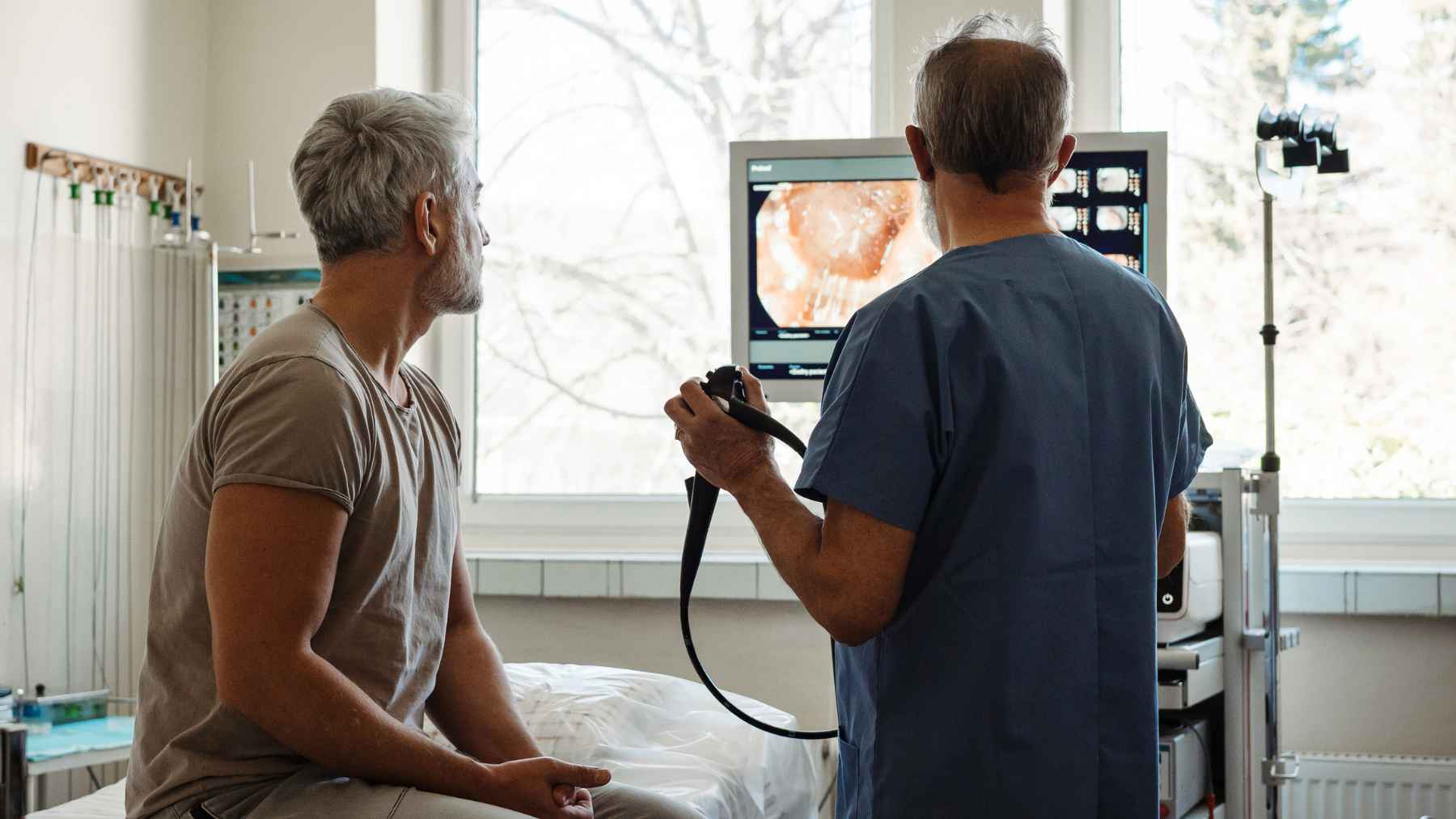 Doctor performing a colonoscopy procedure as part of colorectal cancer screening and prevention efforts.