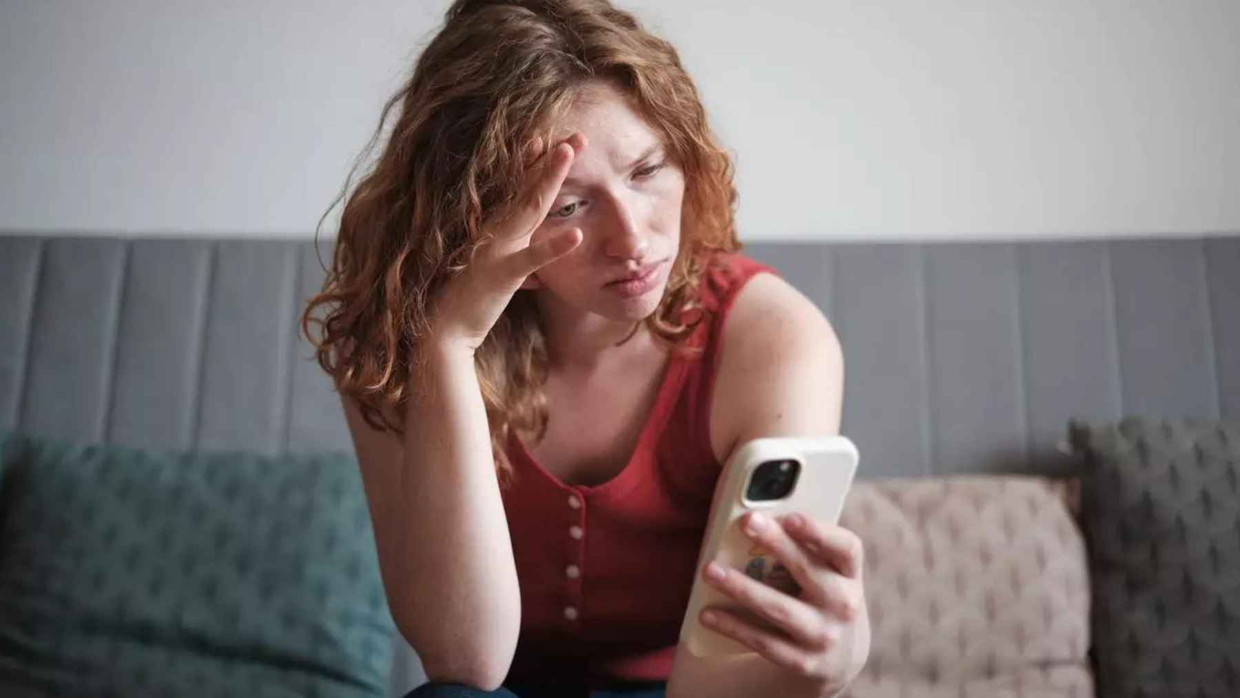 Person sitting alone in deep thought, illustrating the mental habits and repetitive thinking patterns associated with overthinking.