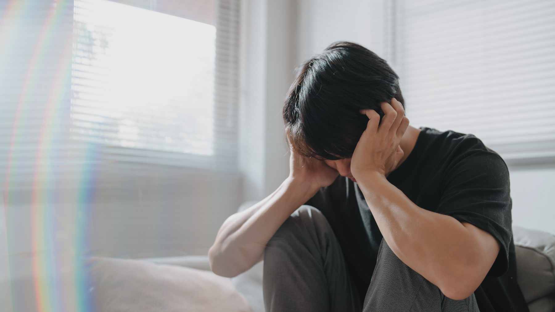 A woman practicing diaphragmatic breathing in a quiet setting to manage anxiety and lower stress levels.