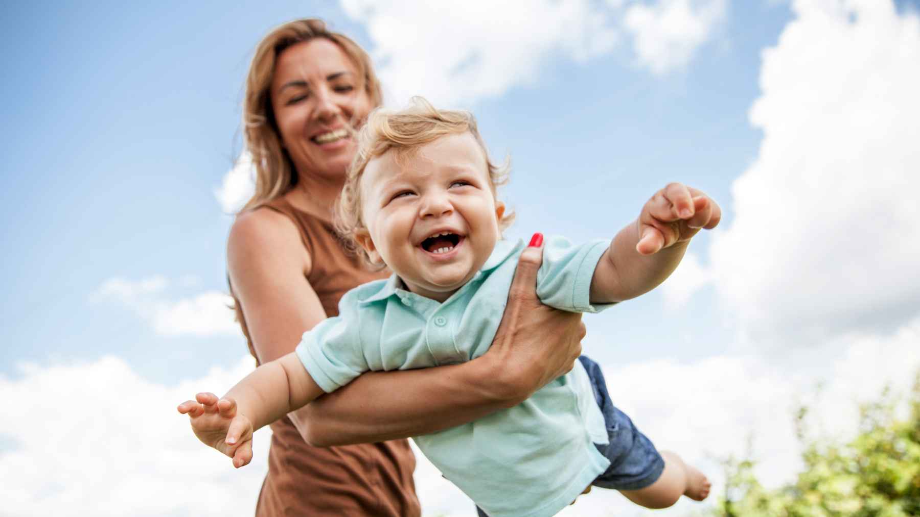 Parent and child sharing a calm moment together, illustrating the emotional security and attachment linked to a happy childhood.
