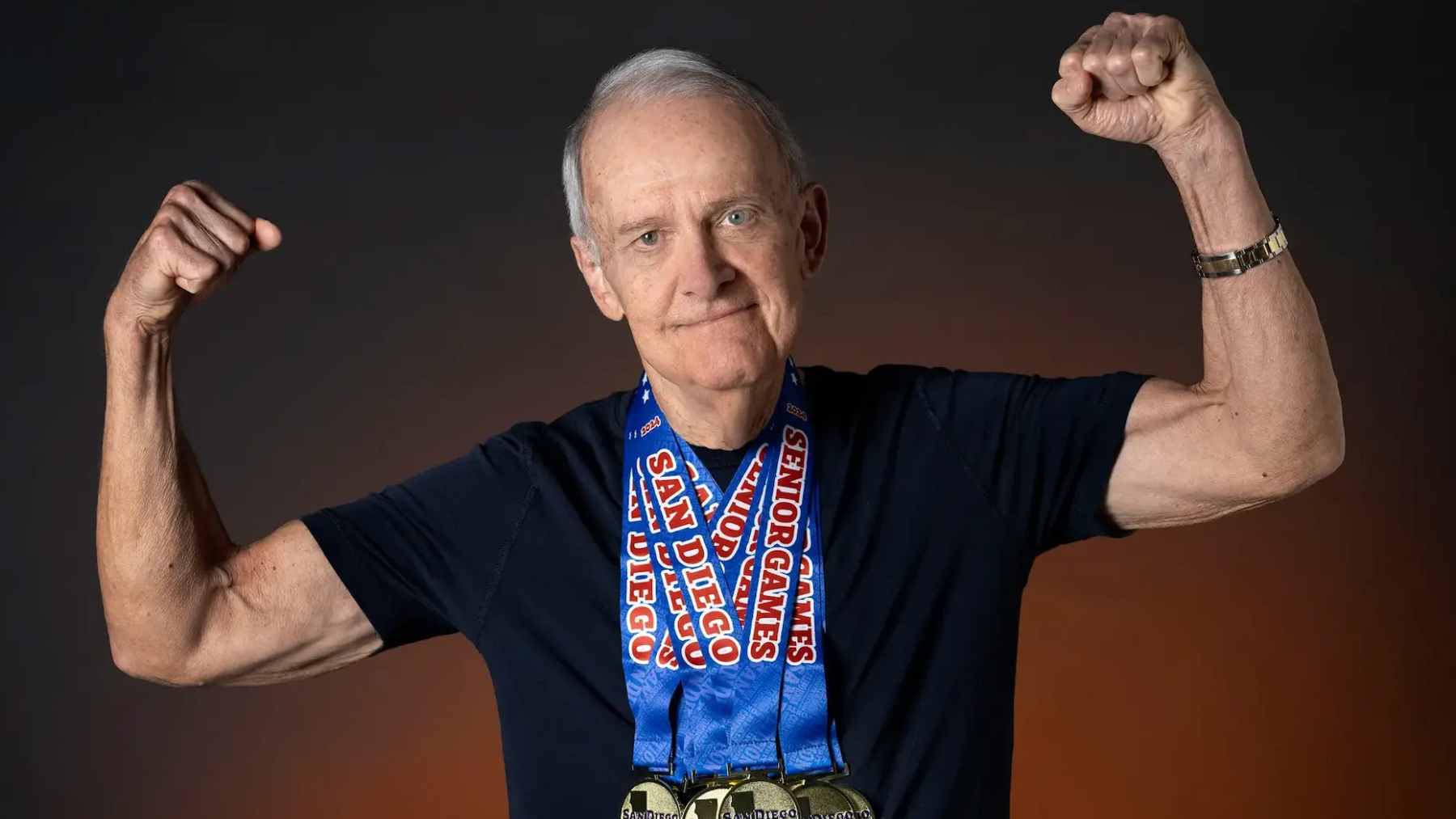 Jim Owen, an 85-year-old senior athlete and documentary filmmaker, demonstrating strength training techniques to promote healthy aging.