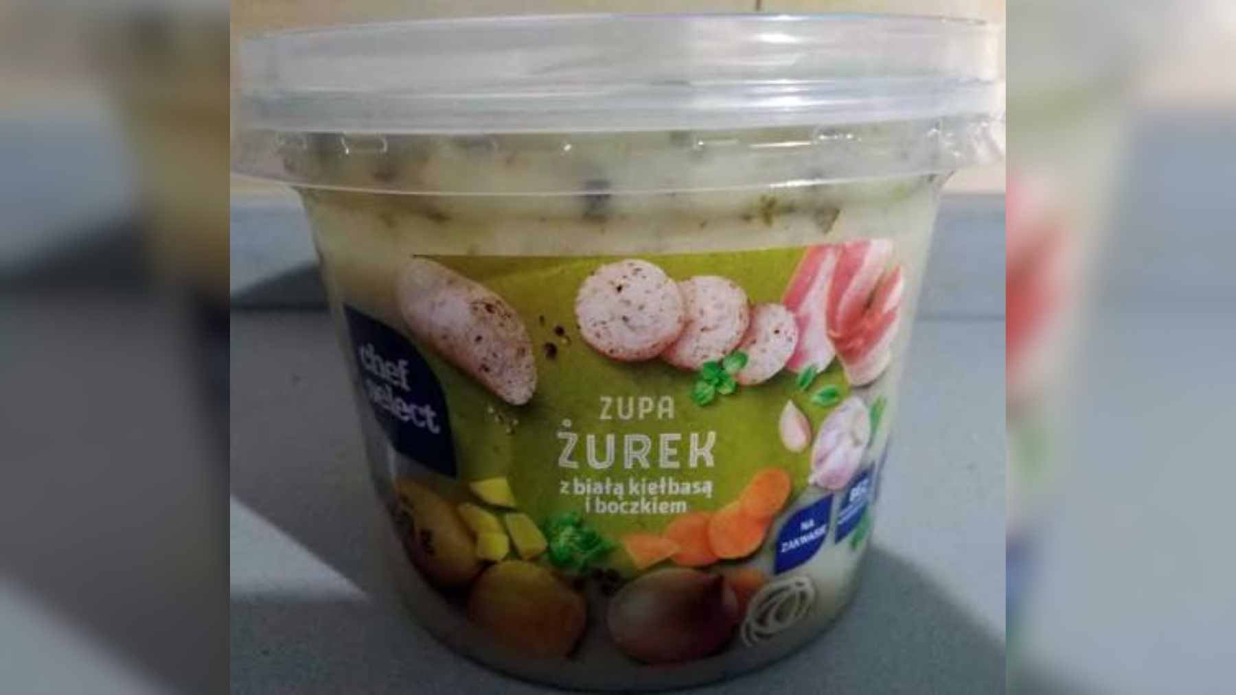 A bowl of Chef Select żurek soup from Lidl featuring white sausage, bacon, and traditional rye base.
